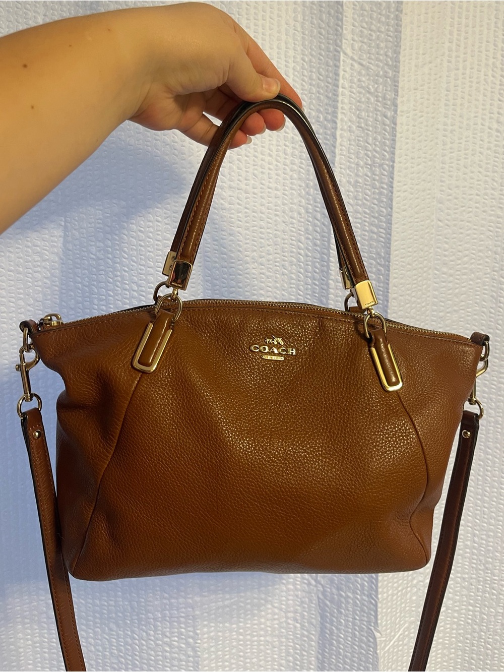 45. Brown coach purse.